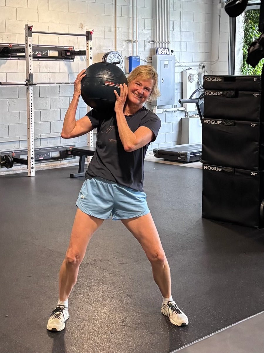 Jen Ellison, 60, training with a medicine ball at Lilley Fitness.