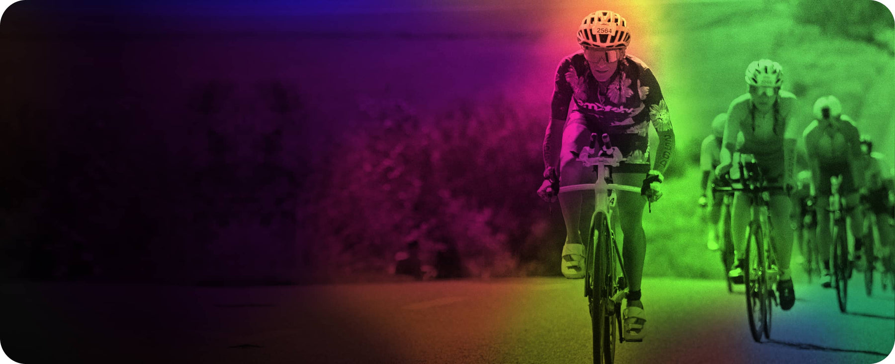 Erika Lilley racing on a road bike in a helmet.